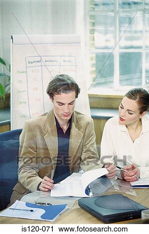 Businessman and businesswoman in office View Large Photo Image Stock Image - Businessman and businesswoman in office. Fotosearch