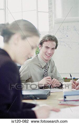 Businessman and businesswoman in office View Large Photo Image Stock Image - Businessman and businesswoman in office. Fotosearch