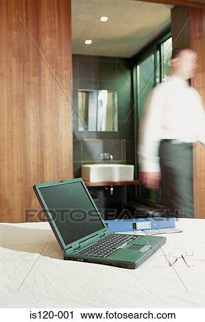 Businessman at home with laptop View Large Photo Image Stock Image - Businessman at home with laptop. Fotosearch