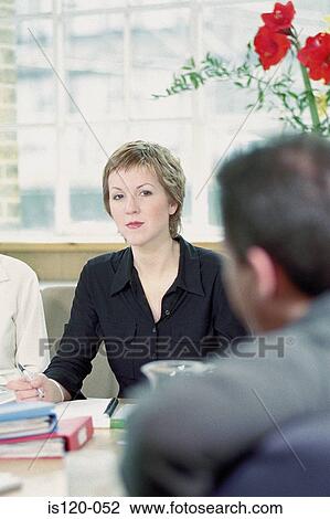 Businesspeople in office View Large Photo Image Stock Image - Businesspeople in office. Fotosearch