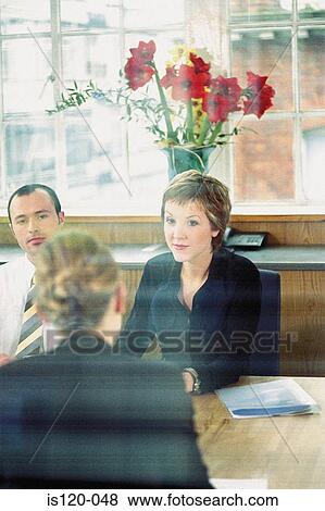 Businesspeople in office View Large Photo Image Stock Photo - Businesspeople in office. Fotosearch
