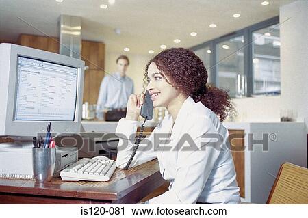 Businesswoman on telephone in office View Large Photo Image Stock Image - Businesswoman on telephone in office. Fotosearch