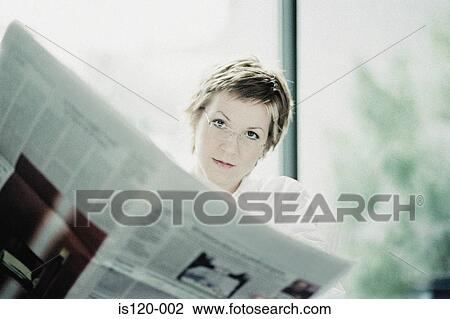 Businesswoman reading paper View Large Photo Image Stock Image - Businesswoman reading paper. Fotosearch