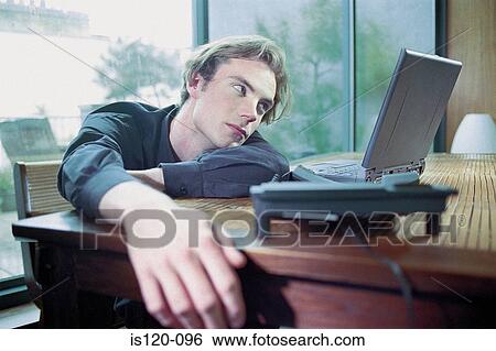 Man on laptop at home View Large Photo Image Stock Photograph - Man on laptop at home. Fotosearch