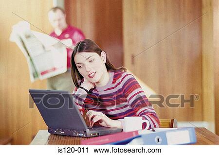 Woman on laptop at home View Large Photo Image Stock Image - Woman on laptop at home. Fotosearch