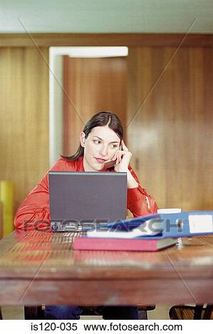 Woman working at home View Large Photo Image Stock Photography - Woman working at home. Fotosearch