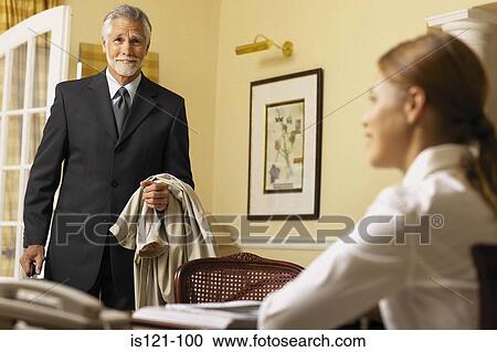 Businessman and businesswoman in office View Large Photo Image Stock Image - Businessman and businesswoman in office. Fotosearch