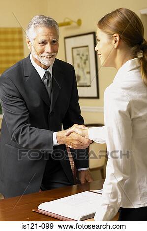 Businessman and businesswoman shaking hands View Large Photo Image Stock Photo - Businessman and businesswoman shaking hands. Fotosearch