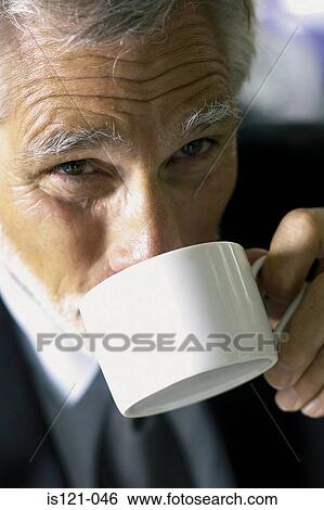 Stock Photograph - Businessman drinking coffee. Fotosearch