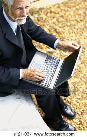 Businessman with computer View Large Photo Image Stock Photo - Businessman with computer. Fotosearch