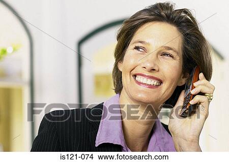 Businesswoman with cellphone View Large Photo Image Picture - Businesswoman with cellphone. Fotosearch