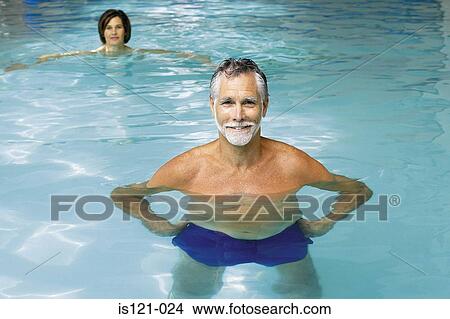 Man and woman in swimming pool View Large Photo Image Picture - Man and woman in swimming pool. Fotosearch