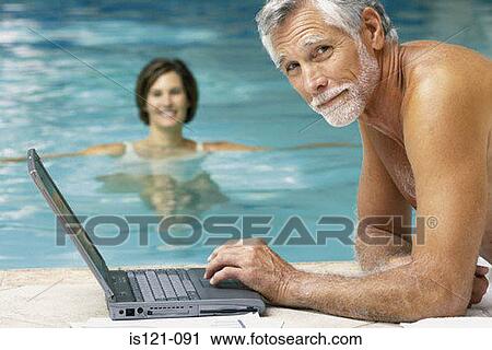 Man and woman in swimming pool with computer View Large Photo Image Stock Image - Man and woman in swimming pool with computer. Fotosearch