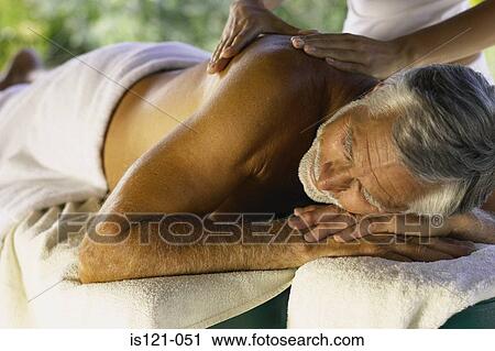 Man being massaged View Large Photo Image Stock Image - Man being massaged. Fotosearch