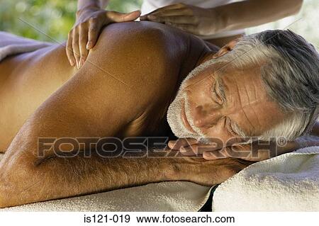 Stock Photo - Man being massaged. Fotosearch