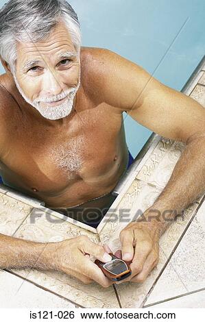 Man in swimming pool with cellphone View Large Photo Image Stock Photograph - Man in swimming pool with cellphone. Fotosearch