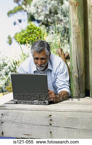 Man outside with computer View Large Photo Image Stock Photography - Man outside with computer. Fotosearch