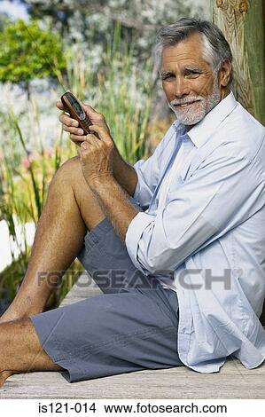 Man with cellphone View Large Photo Image Picture - Man with cellphone. Fotosearch