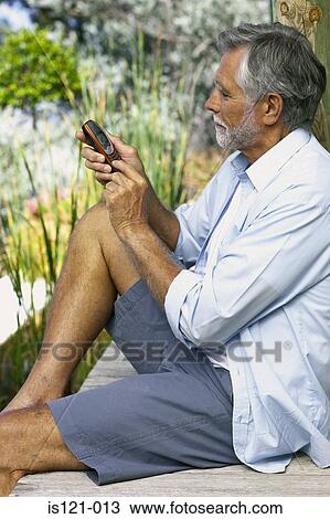 Man with cellphone View Large Photo Image Stock Image - Man with cellphone. Fotosearch