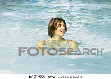Stock Photograph - Woman in swimming pool. Fotosearch