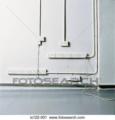 Exposed plugs and wires on an empty office View Large Photo Image Stock Image - Exposed plugs and wires on an empty office . Fotosearch