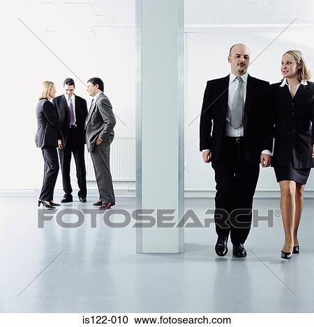 Men and women talking at an open plan office View Large Photo Image Stock Image - Men and women talking at an open plan office . Fotosearch