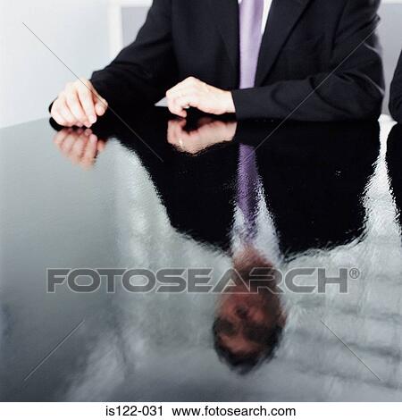 Reflection of a businessman on a shiny black desk View Large Photo Image Stock Image - Reflection of a businessman on a shiny black desk. Fotosearch