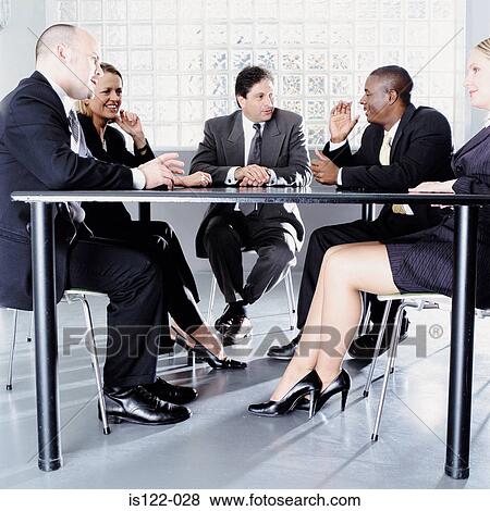 Women and men at a meeting room View Large Photo Image Stock Photo - Women and men at a meeting room. Fotosearch