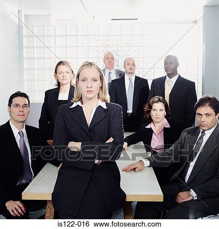Stock Photograph - Women and Men at a meeting room. Fotosearch