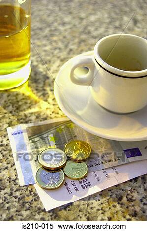 Stock Photography - Coffee and euros. Fotosearch
