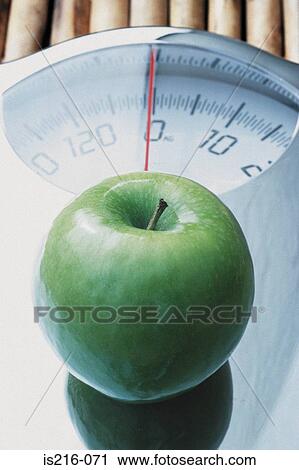 Apple and scales View Large Photo Image Stock Image - Apple and scales. Fotosearch