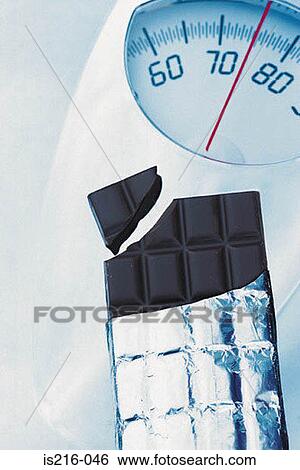Stock Photograph - Chocolate and scales. Fotosearch