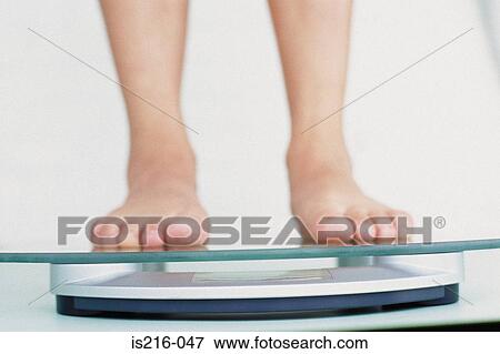 Feet on scales View Large Photo Image Stock Photo - Feet on scales. Fotosearch