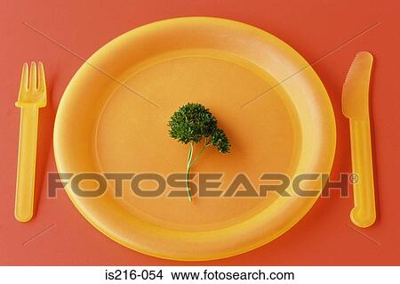 Picture - Sprig of parsley on a plate. Fotosearch