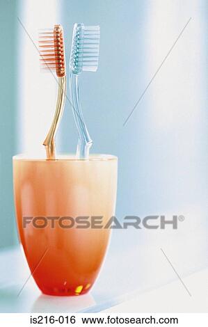 Toothbrushes in a cup View Large Photo Image Stock Photograph - Toothbrushes in a cup. Fotosearch