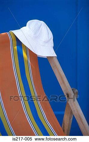 Stock Photography - Deckchair and sun hat. Fotosearch