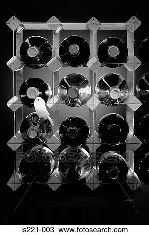 Stock Image - Bottles of wine in rack. Fotosearch