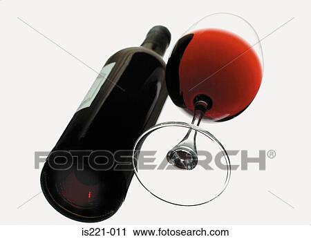 Stock Image - Glass and bottle of red wine. Fotosearch