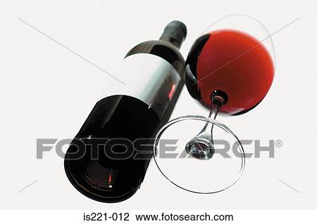 Stock Image - Glass and bottle of red wine. Fotosearch