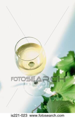 Stock Image - Glass of white wine. Fotosearch