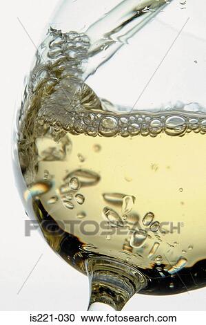 Stock Image - Glass of white wine. Fotosearch