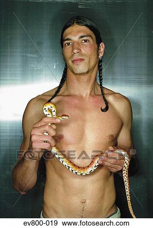 Stock Photo - Man with snake. Fotosearch