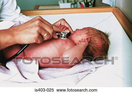 Doctor examining newborn View Large Photo Image Stock Photography - Doctor examining newborn. Fotosearch