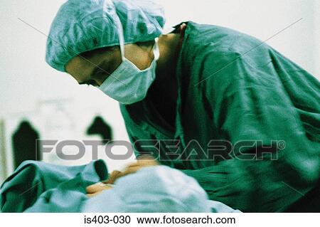 Stock Image - Female surgeon. Fotosearch