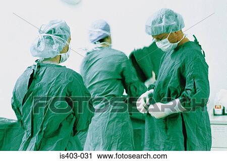 Surgeons dressing for operation View Large Photo Image Stock Image - Surgeons dressing for operation. Fotosearch