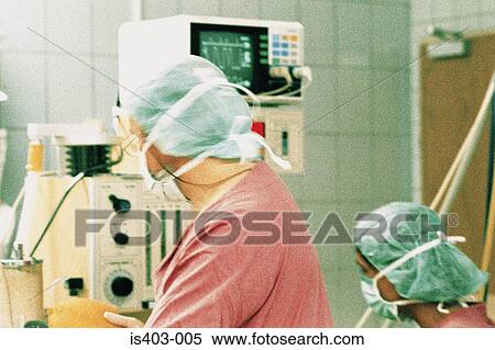 Surgeons in operating theatre View Large Photo Image Stock Photography - Surgeons in operating theatre. Fotosearch