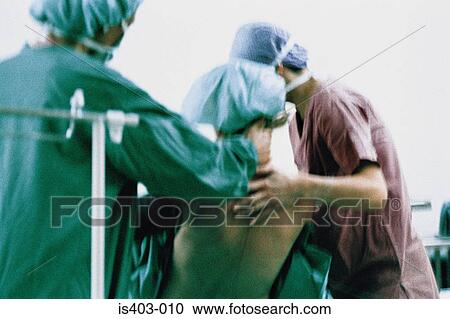 Surgeons supporting patient View Large Photo Image Stock Image - Surgeons supporting patient. Fotosearch