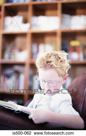 Stock Image - Boy doing homework. Fotosearch