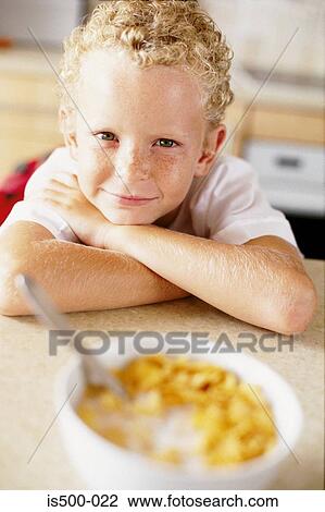 Boy having breakfast View Large Photo Image Stock Image - Boy having breakfast. Fotosearch