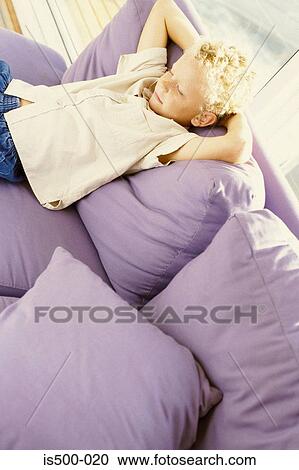 Boy on sofa View Large Photo Image Stock Image - Boy on sofa. Fotosearch